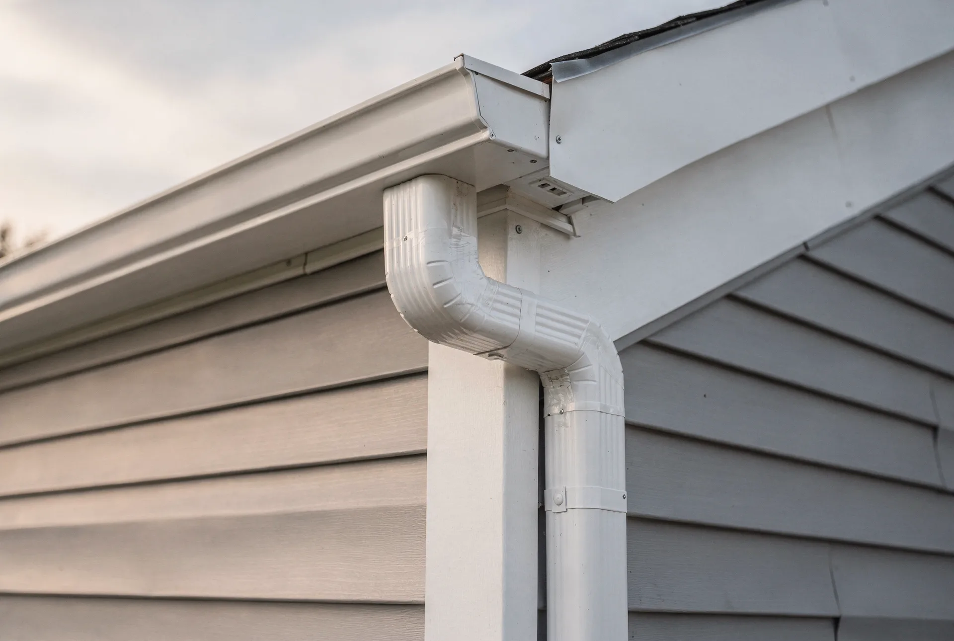New seamless gutter and downspout on clean fascia